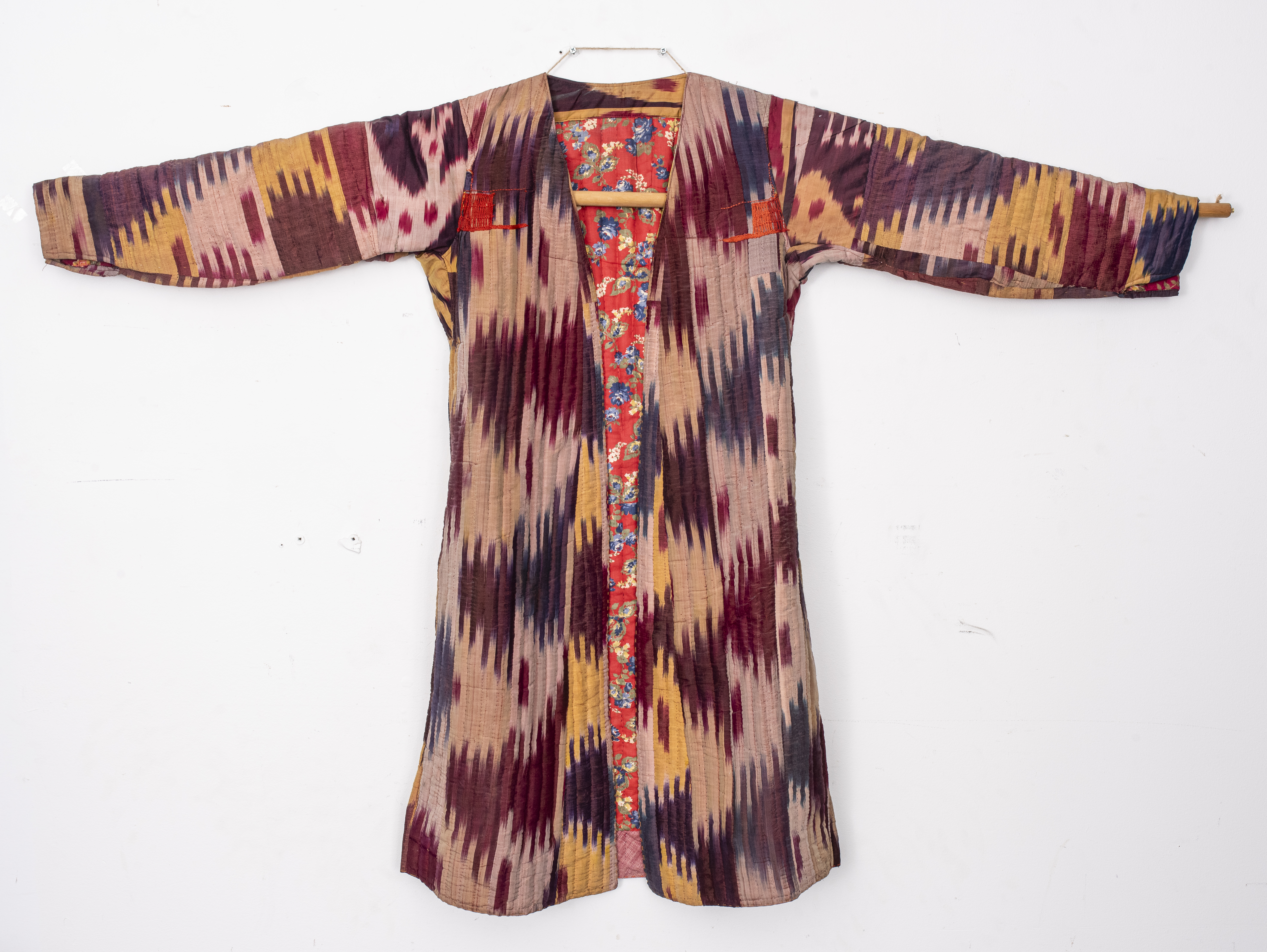 Appraisal: ANTIQUE UZBEK IKAT SILK COAT Antique Uzbek hand-loomed Ikat coat