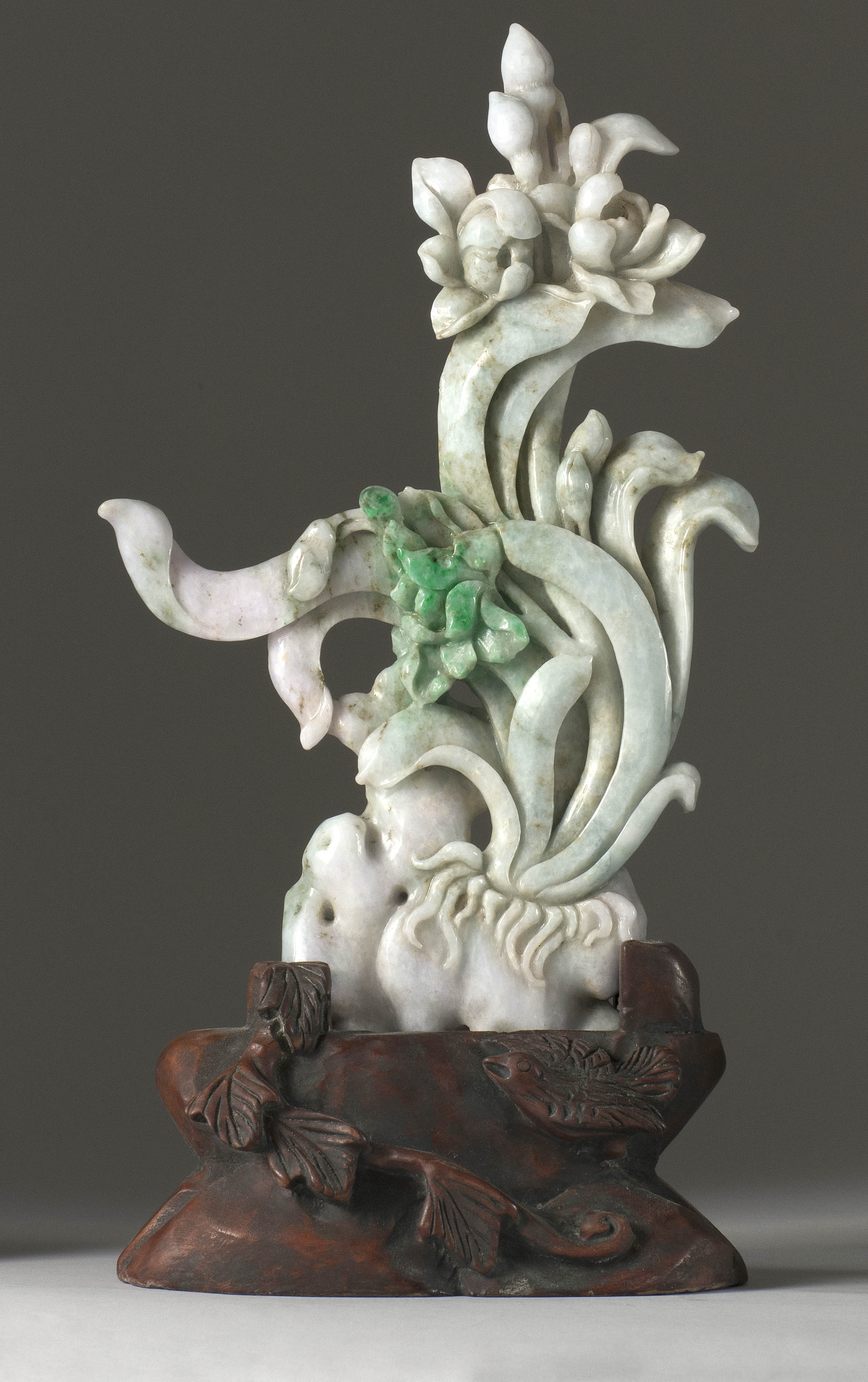 Appraisal: GREEN AND WHITE JADE CARVING In flower form with openwork