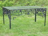 Appraisal: PATIO TABLE - Wrought iron patio table with glass top