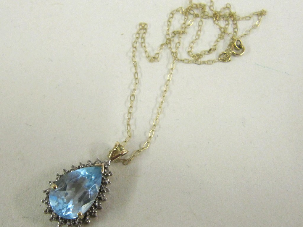 Appraisal: Nine carat gold blue topaz and diamond pear shaped pendant