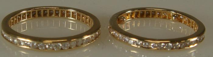 Appraisal: Pair of K YG diamond eternity rings each set all