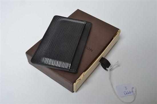 Appraisal: A SIMPLE CARD HOLDER BY LOUIS VUITTON Styled in black