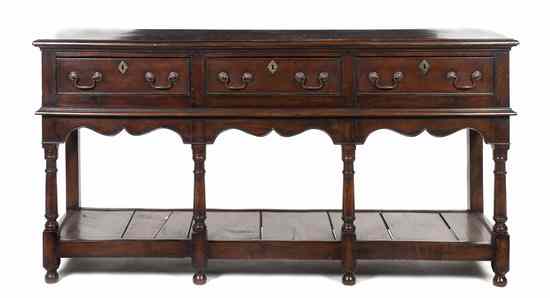 Appraisal: A Provincial Oak Welsh Server having a rectangular top with