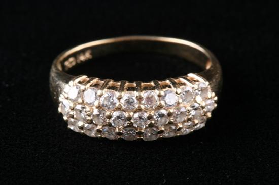 Appraisal: K YELLOW GOLD AND DIAMOND RING Composed of three rows