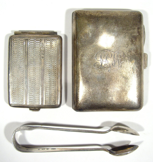 Appraisal: Silver vesta with engine turned decoration a cigarette case and