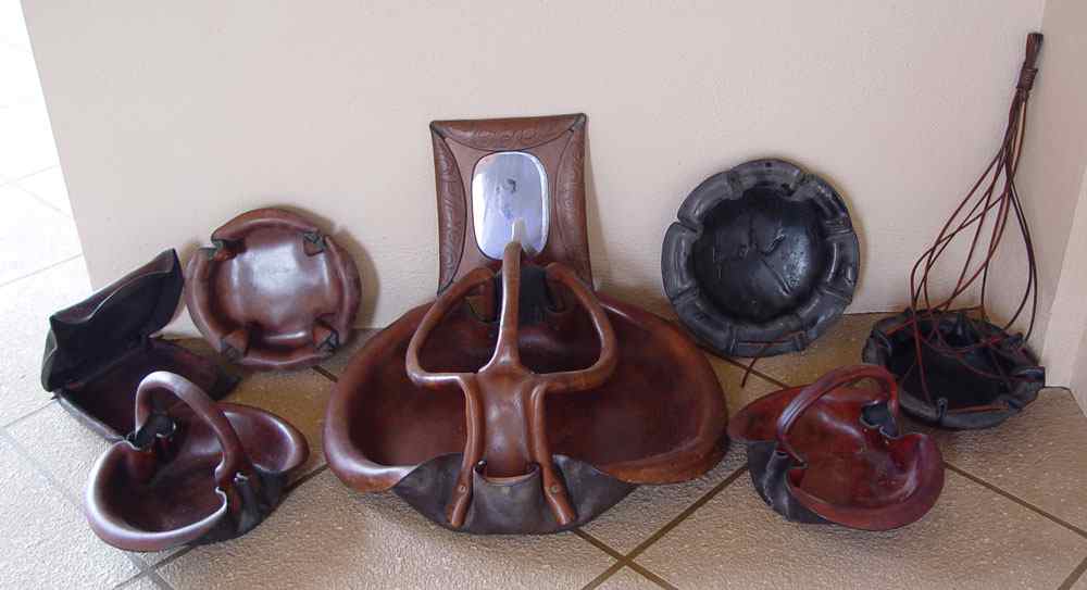 Appraisal: COLLECTION OF HARD LEATHER BASKETS To include handled baskets marked