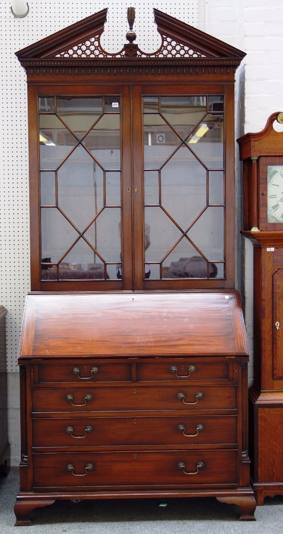 Appraisal: A mid th century style mahogany bureau bookcase the pierced