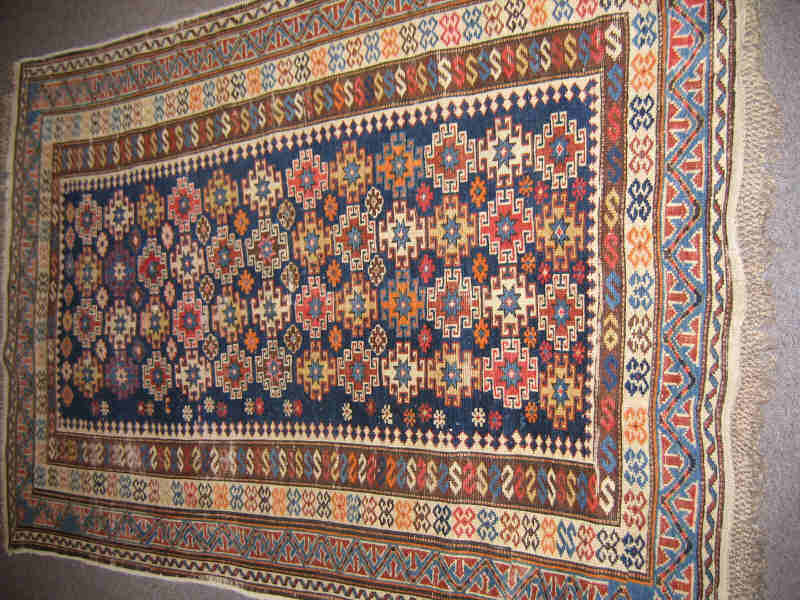 Appraisal: SHIRVAN CAUCASIAN TRIBAL THROW RUG The indigo field shows an