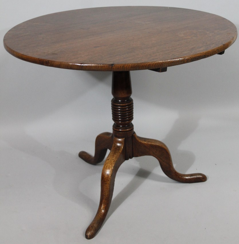 Appraisal: An early thC oak snap top occasional table the plain