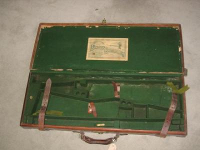 Appraisal: A LEATHER GUN CASE for a pair of shotguns with