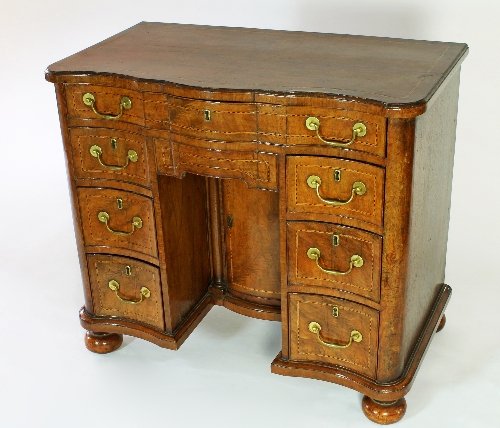 Appraisal: An th Century walnut kneehole desk the top and configuration