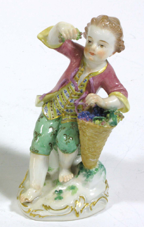 Appraisal: MEISSEN PORCELAIN FIGURE barefoot boy holding aloft grapes from his