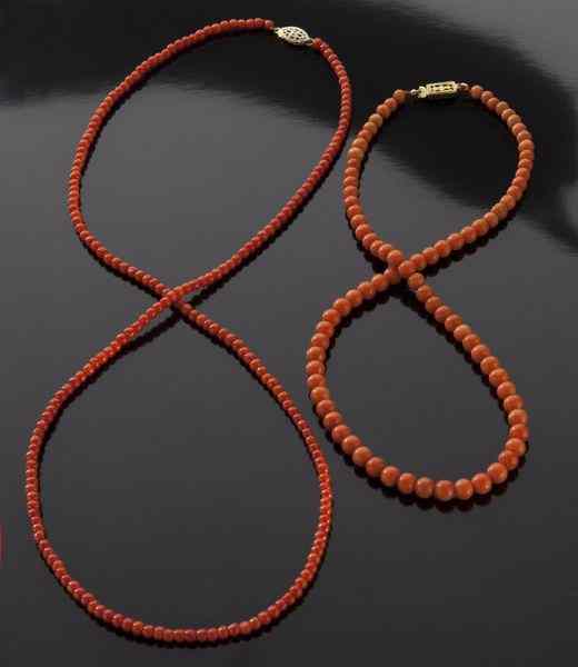 Appraisal: Chinese carved red coral necklaces International shipping IS NOT available