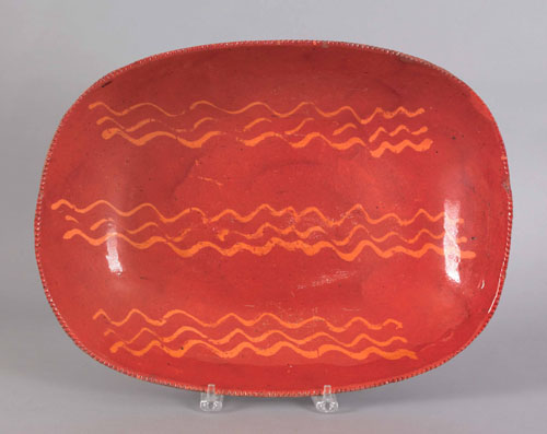 Appraisal: Pennsylvania redware loaf dish th c with yellow slip decoration