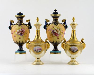 Appraisal: A pair of Coalport vases and covers painted with small