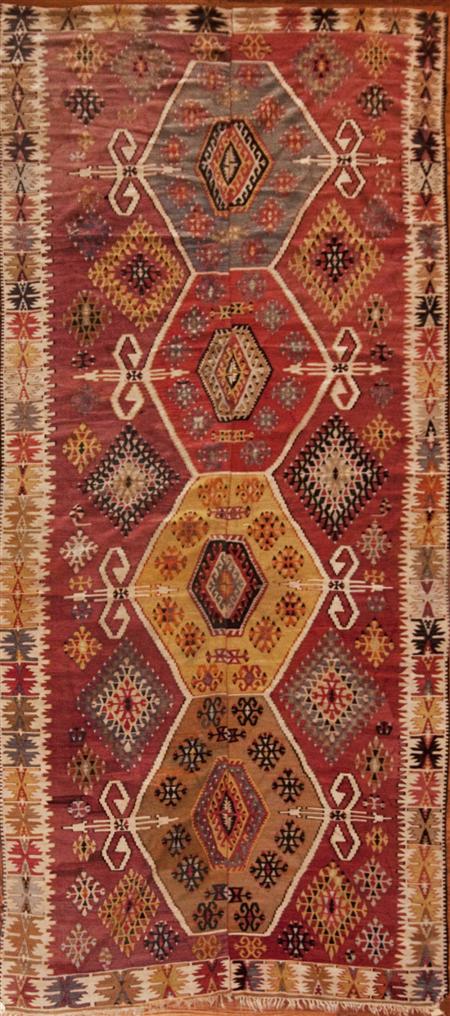 Appraisal: An Anatolian kelim th century the red field woven in