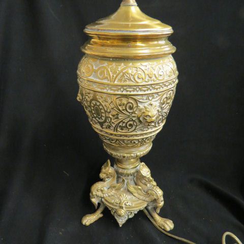 Appraisal: Victorian Brass lamp serpent feet faces rococo design body electrified