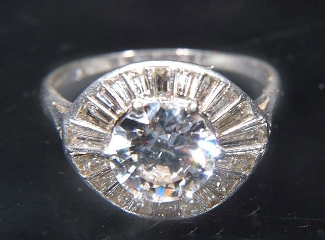 Appraisal: A DIAMOND SET DRESS RING central claw set brilliant cut