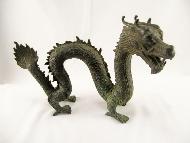 Appraisal: Oriental Style Cast Iron Dragon Cast iron dragon with hunched