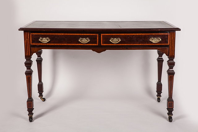 Appraisal: A LATE VICTORIAN MAHOGANY WRITING TABLE with inset green tooled