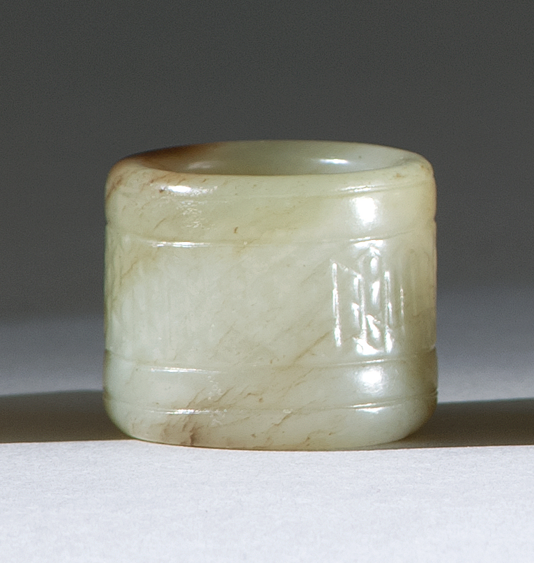 Appraisal: LIGHT GREEN JADE ARCHER'S RING th CenturyWith brown splash at