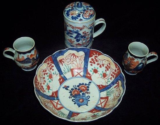 Appraisal: A Japanese Imari bowl two tankards and a brush pot