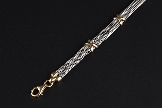 Appraisal: A French fancy-link bracelet of two colour design comprising two