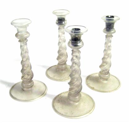 Appraisal: Four blown irridescent candlestickspossibly steuben glass co corning ny