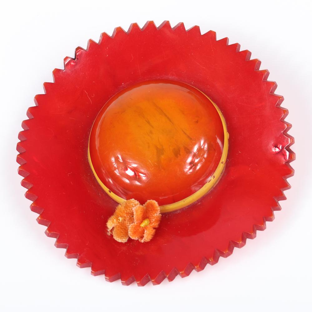 Appraisal: VINTAGE SWIRLED BAKELITE RED OVERDYED DIMENSIONAL FIGURAL SUN HAT PIN