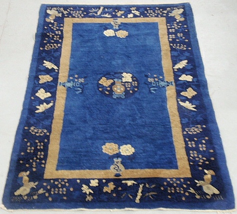 Appraisal: - Blue Chinese oriental mat with bird and potted flower