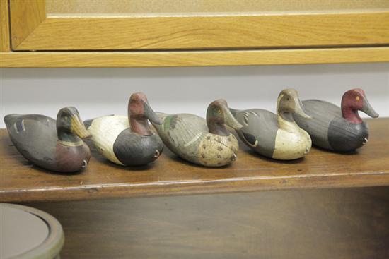 Appraisal: FIVE MINIATURE DECOYS Carved and polychrome painted duck decoys All