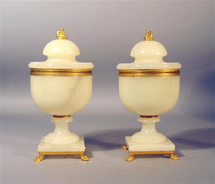 Appraisal: Pair of gilt metal mounted onyx urns th century Each