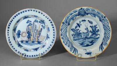 Appraisal: Two Delft plates one with stag in woodland setting scalloped