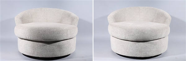 Appraisal: Pair of modern upholstered circular swivel chairs wear some stains