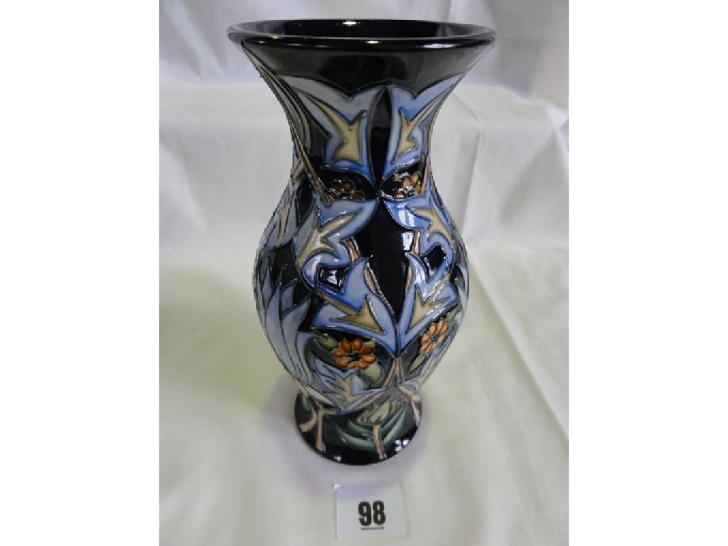 Appraisal: A Moorcroft Pottery blue ground vase of baluster shaped form