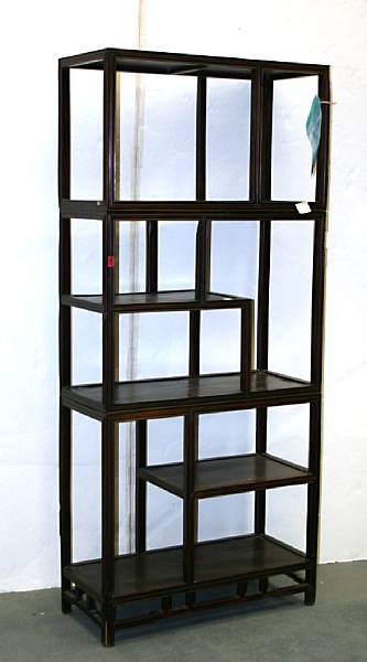 Appraisal: A Chinese mixed wood three-section display cabinet th Century The