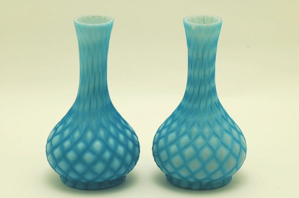 Appraisal: Pair of Victorian blue quilted satin glass vases round bases