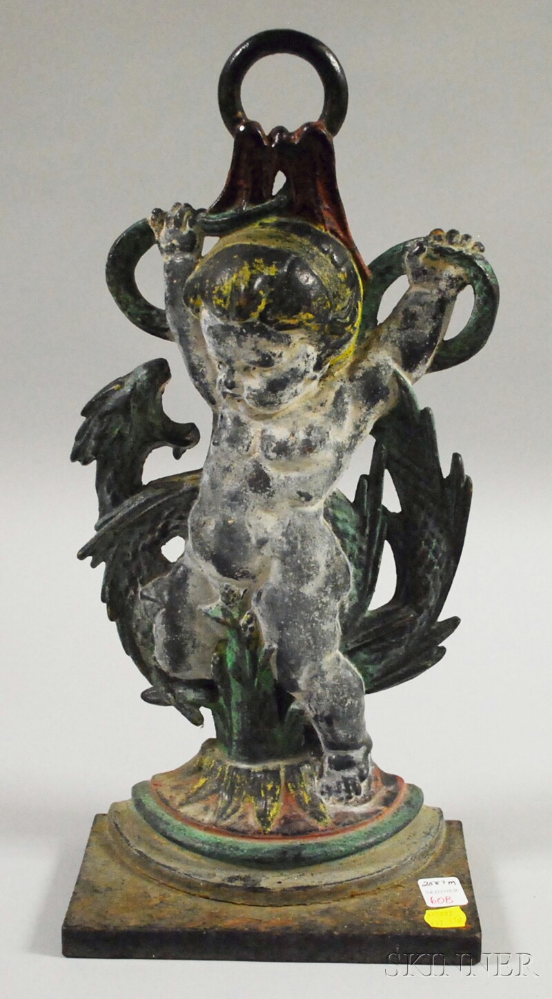 Appraisal: Painted Cast Iron Cherub and Sea Serpent Doorstop ht in