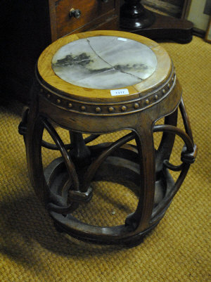 Appraisal: A Chinese barrel shaped hardwood stool inset with marble top