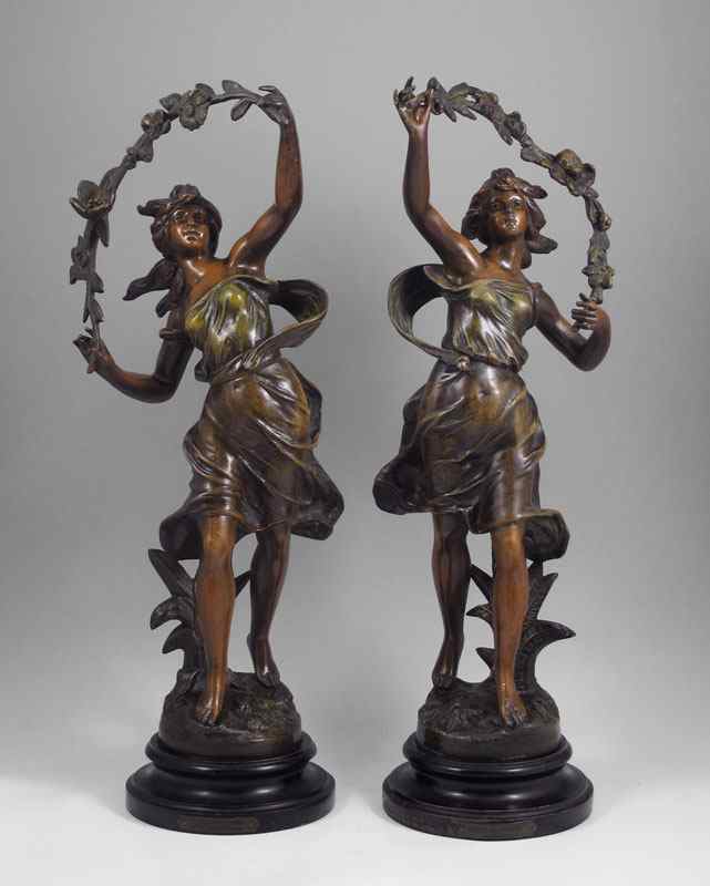 Appraisal: PAIR OF PATINATED METAL SCULPTURES AFTER GUILLEMIN Depicting Nouveau young