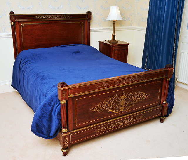 Appraisal: AN ANTIQUE FRENCH MAHOGANY AND BRASS BED HEAD AND END