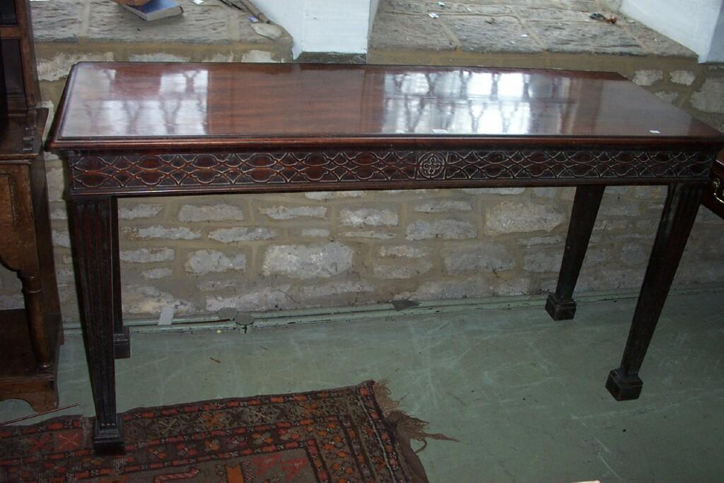 Appraisal: A Georgian mahogany serving table raised on square taper and