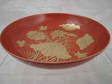 Appraisal: A shallow Chinese dish the pale red glaze with applied