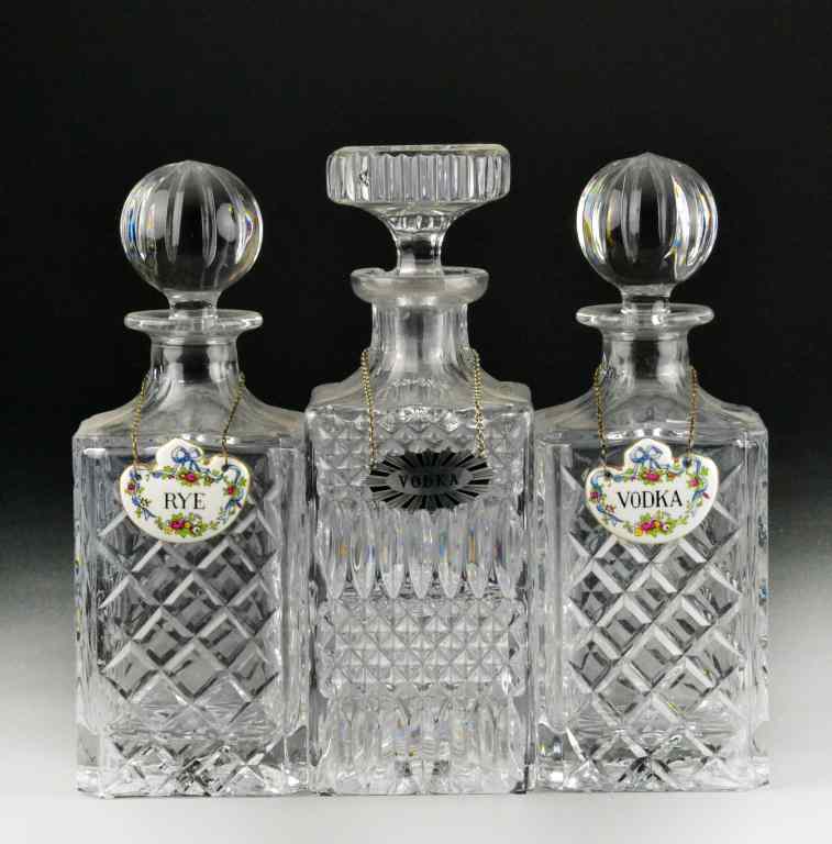 Appraisal: Glass DecantersConsisting of two cut glass and one pressed glass