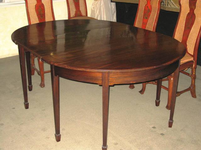 Appraisal: A late George III mahogany D-end dining table with one