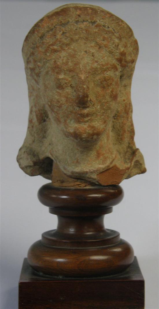 Appraisal: Greco-Roman painted terracotta head high PROVENANCE Thetis Blacker