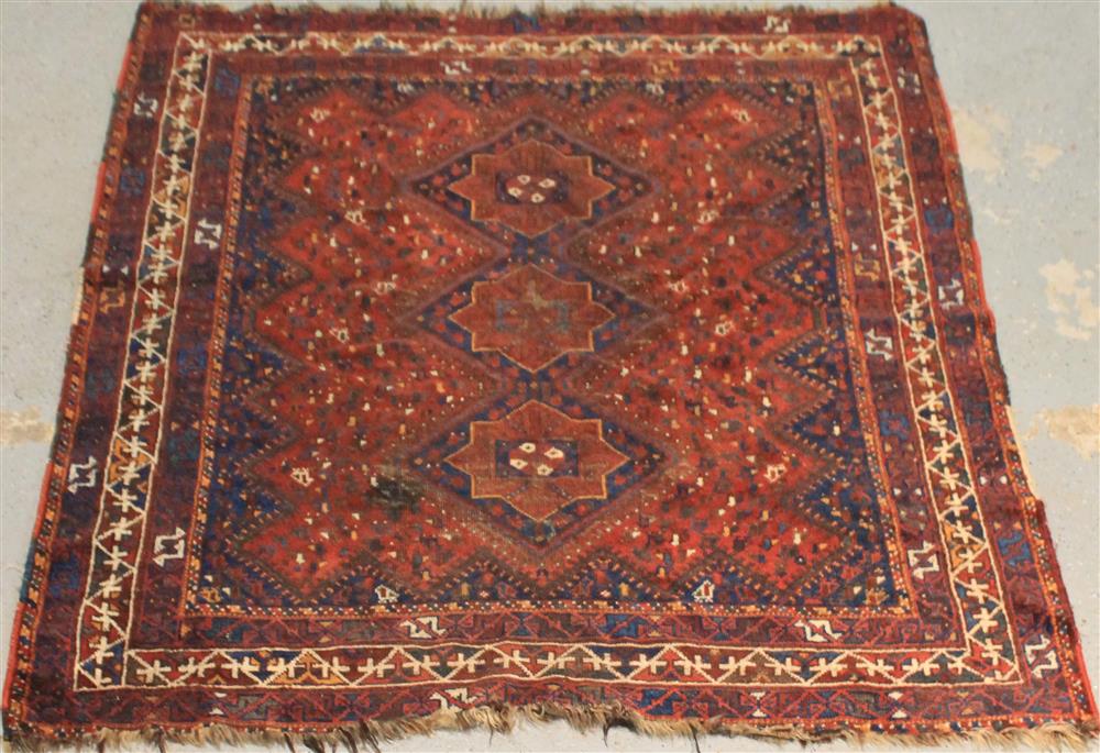 Appraisal: ORIENTAL RUG having a dark ground with blue highlights and