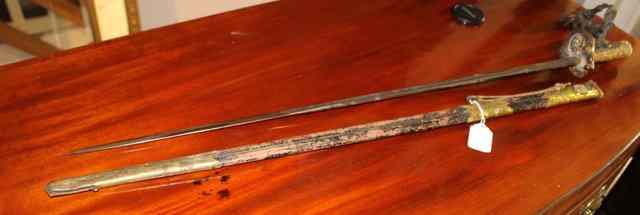 Appraisal: A TH CENTURY OFFICER'S DRESS SWORD with brass mounted scabbard