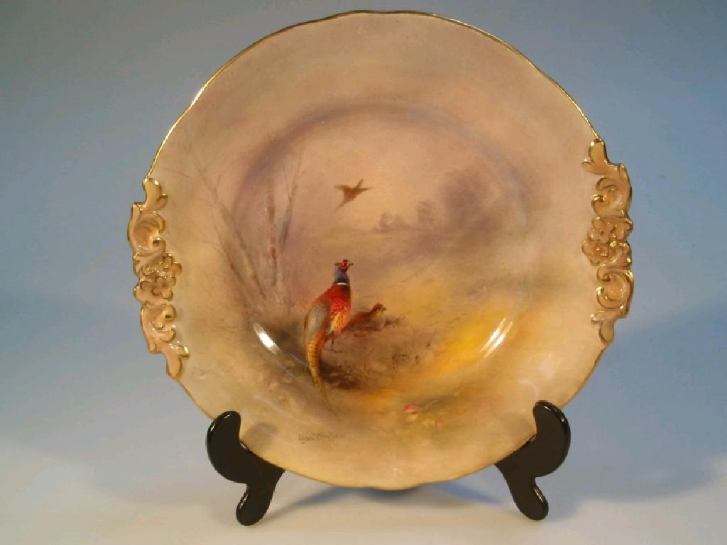 Appraisal: A Royal Worcester plate hand painted with a winter landscape