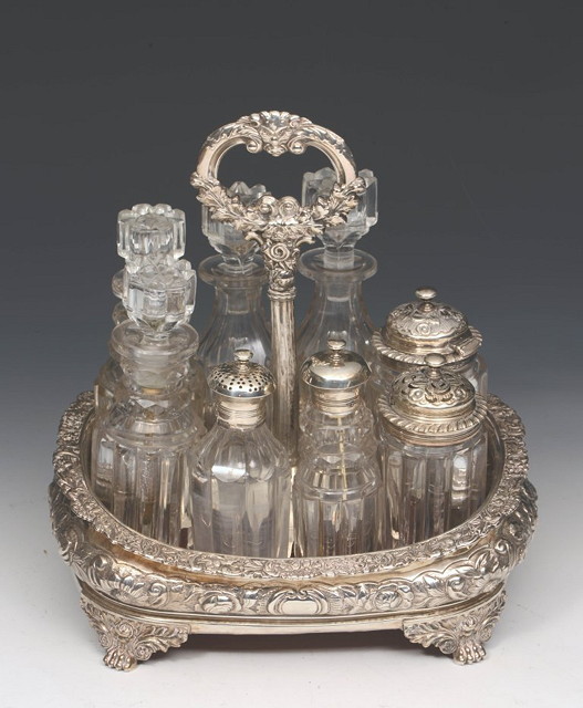 Appraisal: A SILVER EIGHT BOTTLE CRUET SET of boat shaped form